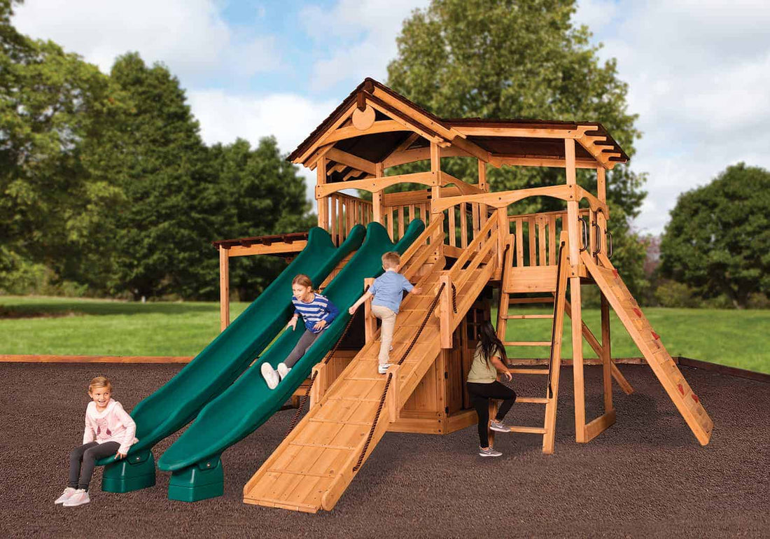 Spring swing set maintenance list - kids sliding and climbing on a playset after spring cleanup