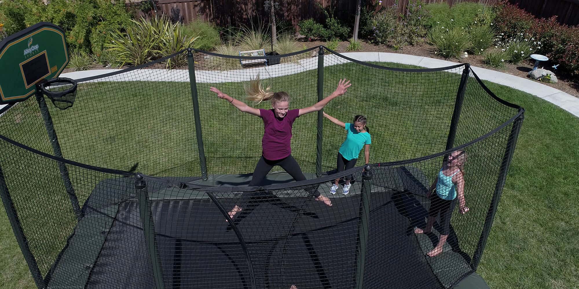 Teenagers jumping on a trampoline