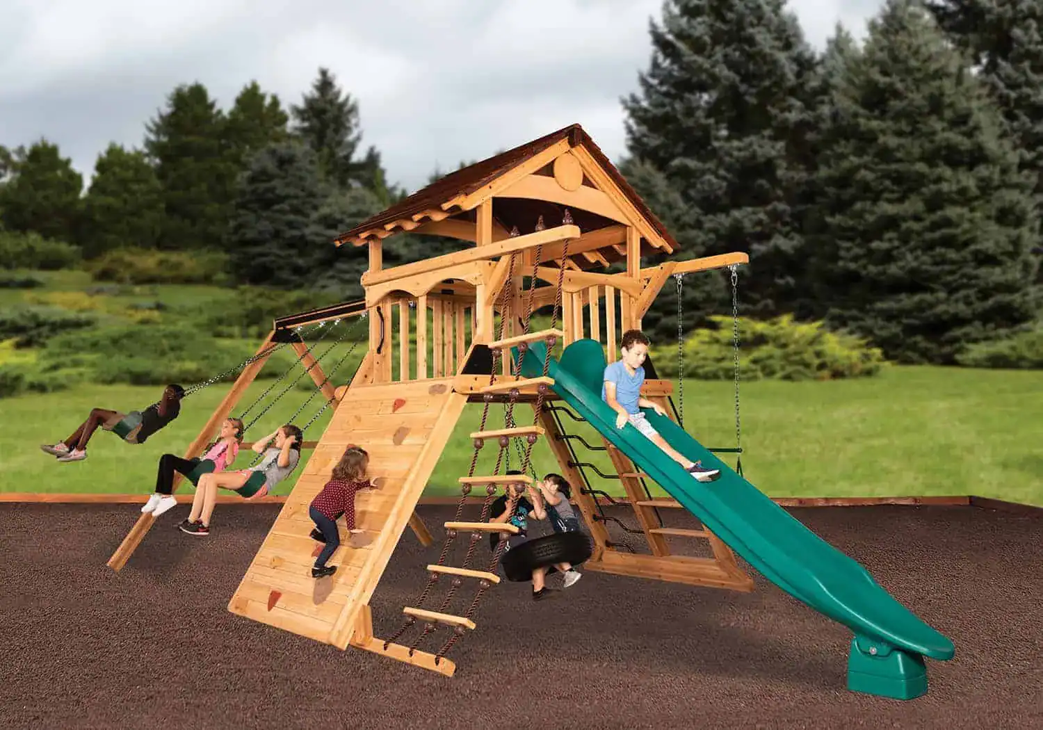 Treehouse Peak Playset For Sale Treehouse Peak wooden playset for sale, kids playing and swinging on wooden swingset